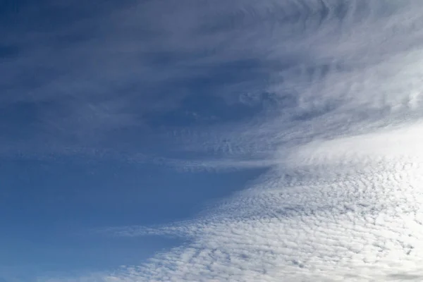 Sky with windy weather clouds scatered by harsh wind. Windy weather concept. Climate change background.