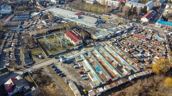 Lutsk, Ukraine - 02-05-2020: Lutsk City central market square. Variety of containers and electrical sub station. Aerieal view from above.