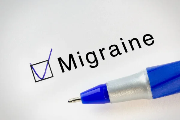 Migraine text on test paper with check mark in form box. Diseases names test series.