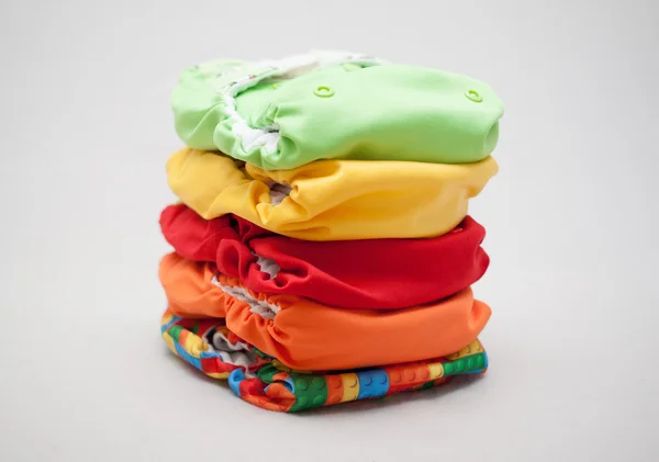 Pilha de fraldas de pano cores diferentes — Fotografia de Stock