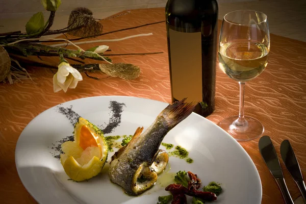 Beautifully arranged table for dinner with glass of wine — Stock Photo, Image