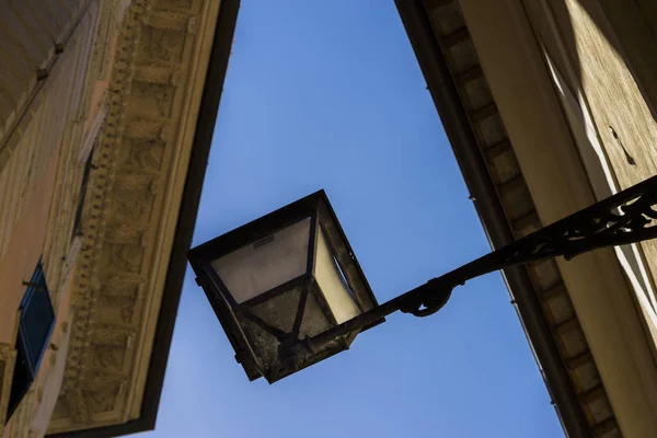 Beautiful street lantern of wrought iron and a glass lampshade — Stock Photo, Image