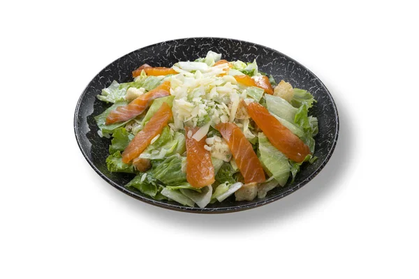 Fresh green salad with salmon fish in beautiful black modern pla — Stock Photo, Image