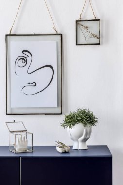 Interesting framed picture in modern apartment interior clipart