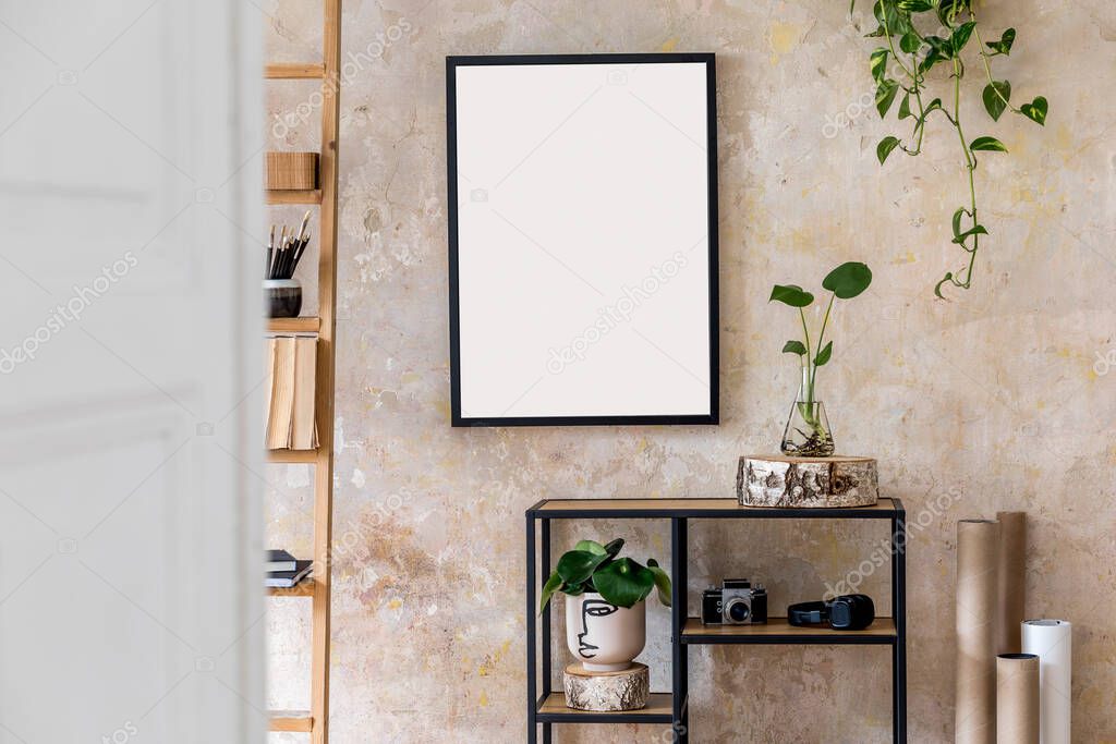 Blank copy space frames on wall in stylish room, creative interior design