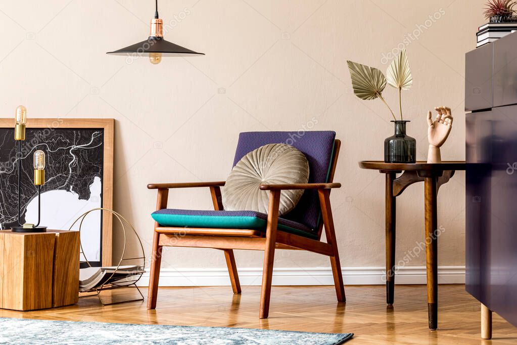 Interior design of retro modern living room with poster frames, blue navy commode, design armchair, table, paper leafs, books, lamp and elegant personal accessories. Stylish home decor. Template.