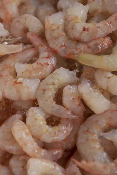 Fresh frozen shrimps on the fish market. Raw shrimps in seafood market