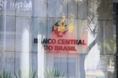 Sao Paulo / Brazil - feb 16 2020 -  Close of the lettering and logo of Banco Central do Brasil on its facade seen through the glass on Paulista avenue