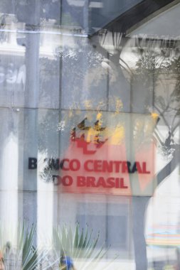 Sao Paulo / Brazil - feb 16 2020 -  Close of the lettering and logo of Banco Central do Brasil on its facade seen through the glass on Paulista avenue