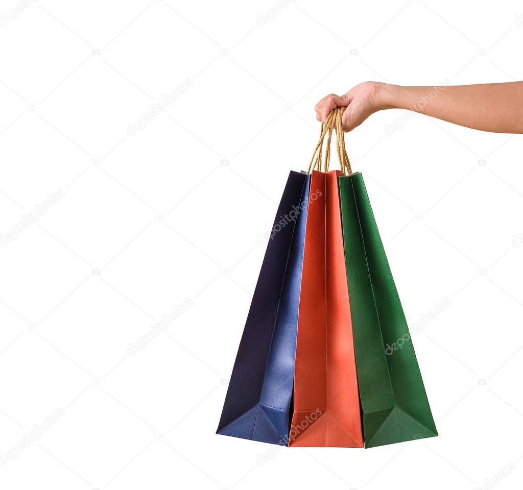 Female hand holding blank colorful papaer shopping bags