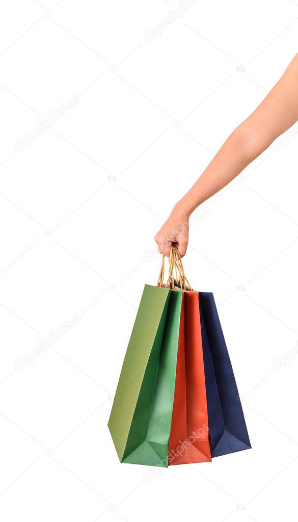 Female hand holding blank colorful papaer shopping bags