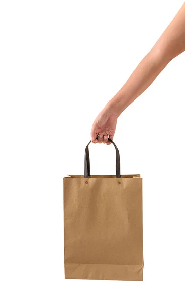 Mano femenina sosteniendo bolsas de compras de papaer marrón en blanco —  Fotos de Stock