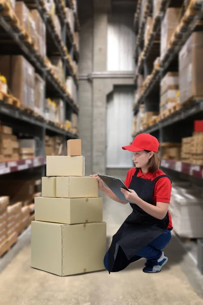 Female staff and parcel boxes checking stock and Blurred the bac