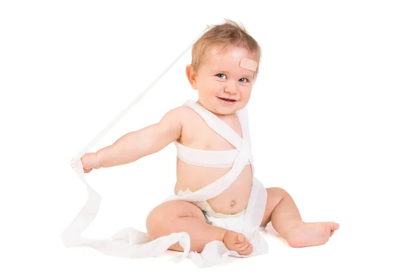 Beautiful baby with bandages — Stock Photo, Image