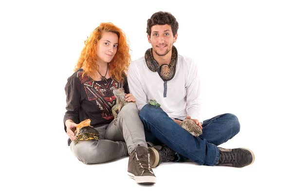 Young couple with pets — Stock Photo, Image