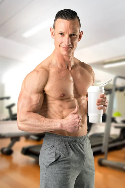 Athlete with drink — Stock Photo, Image