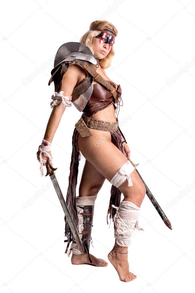Ancient woman warrior or Gladiator posing with sword, isolated in white