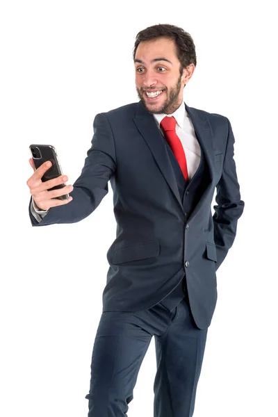 Счастливый Бизнесмен Смотрит Телефон Изолированный Белом — стоковое фото