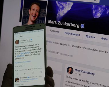 Donald Trump ve sayfa Mark Zuckerberg sayfa ile mobil gadget.