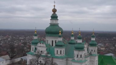 Chernihiv, Ukraine - February 2020: Holy Trinity Cathedral. View of the domes of the church on the background of private houses.