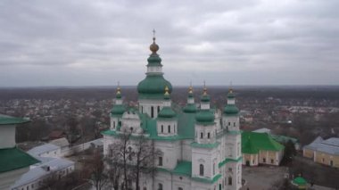 Chernihiv, Ukraine - February 2020: Holy Trinity Cathedral. View of the domes of the church on the background of private houses.