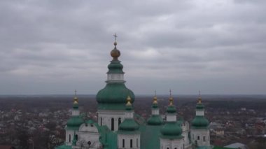 Chernihiv, Ukraine - February 2020: Holy Trinity Cathedral. View of the domes of the church on the background of private houses.