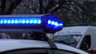 Europe, Kiev, Ukraine - March 2020: close-up of flashing lights of a special vehicle. Blue lights of police flashers and ambulances. Bokeh effect