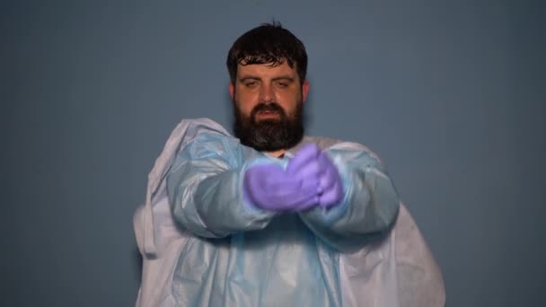 Tired Doctor Takes His Protective Medical Suit Coronavirus Pandemic Sweaty — Stock Video