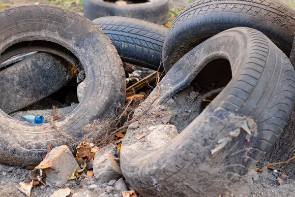 car tires thrown into the trash on the street