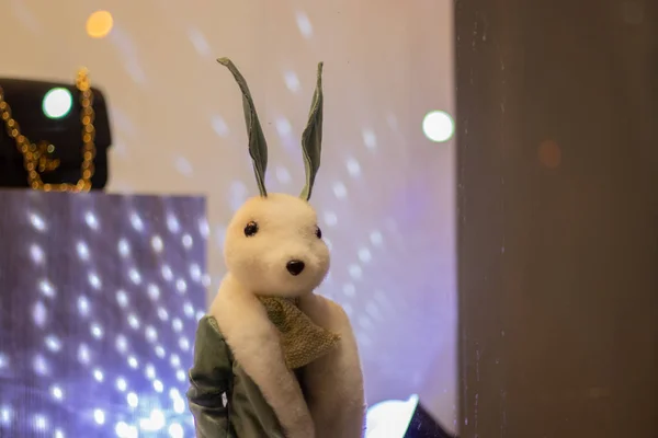 white little children's bunny toy in a shop window