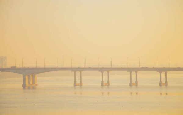 photo of the bridge over the river in the city of Dnieper at dawn