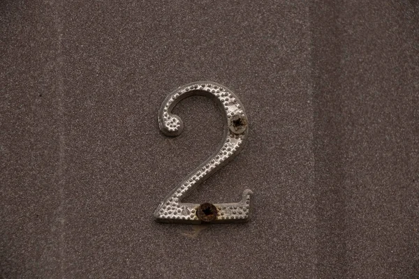 Number 2 on the wall of a house close-up — Stock Photo, Image