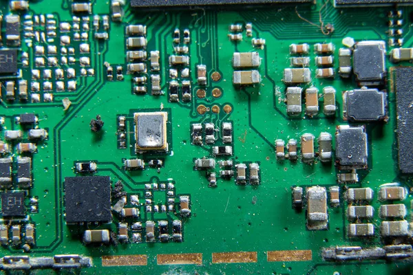 Macro photos showing tablet repair process. Tablet repair under the microscope. Mobile Board: Broken Tablet Board