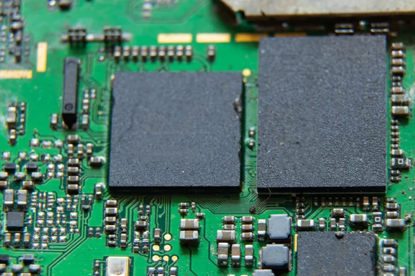 Macro photos showing tablet repair process. Tablet repair under the microscope. Mobile Board: Broken Tablet Board
