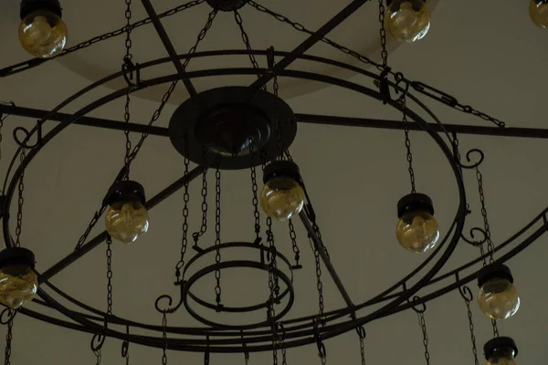 Old vintage chandelier hanging on the ceiling of a hotel in egypt — Stock Photo, Image