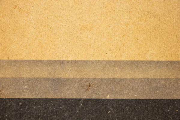 Old yellow paper background with black stripe close up — Stock Photo, Image