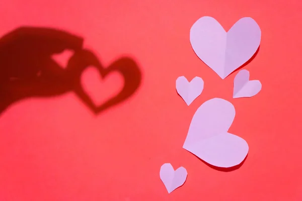 paper cut out heart lies on paper, valentine