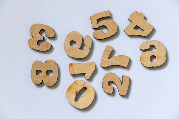 wooden small numbers on an isolated white background