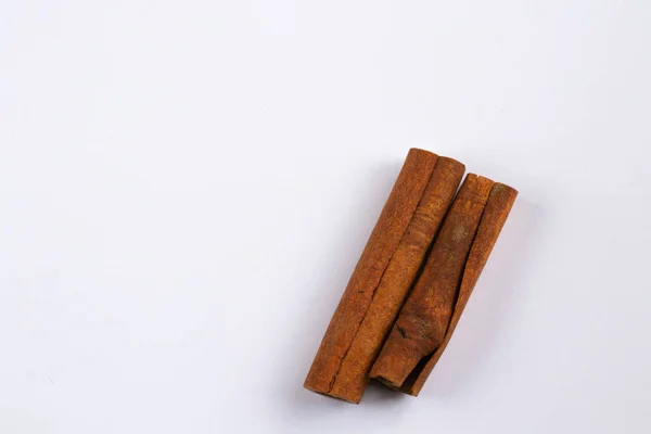 Two cinnamon sticks on an isolated background — ストック写真