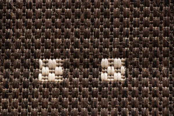 White with black carpet closeup as background — Stockfoto