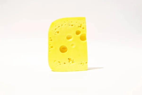 Piece of cheese on a white isolated background — 스톡 사진