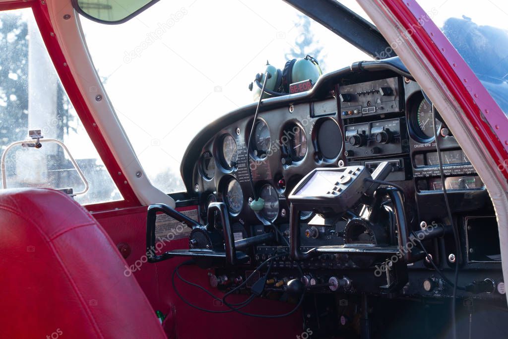 small red airplane pilot's cabin on a sunny day