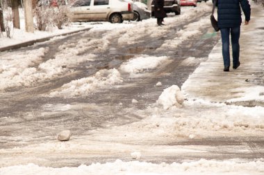 frozen snow from ice on a city street in winter in Ukraine