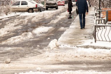 frozen snow from ice on a city street in winter in Ukraine