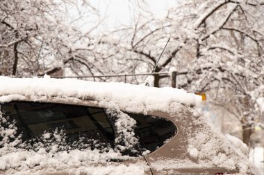 car on the road in Ukraine in the city of Dnipro in the snow on the street in winter