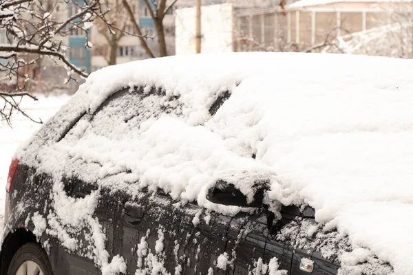 Car on the road in Ukraine in the city of Dnipro in the snow on the street in winter — 图库照片