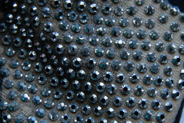 Rhinestones on fabric closeup as background — Stok fotoğraf