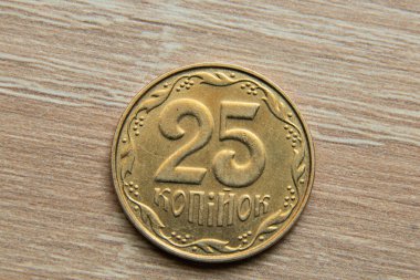 25 kopecks on a wooden table close-up