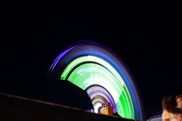 Swing in the parks in motion at night in Ukraine in the park — Stock Photo, Image