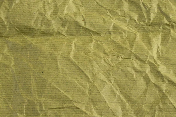 green plain paper crumpled closeup as background